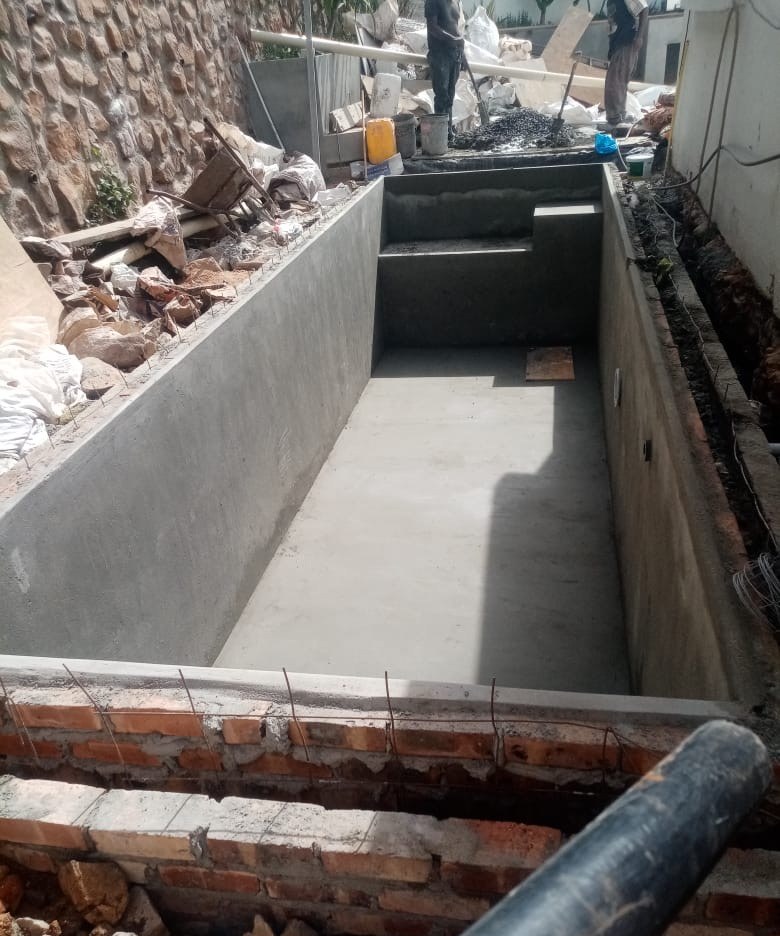Excavated and cast concrete swimming pool shell during construction